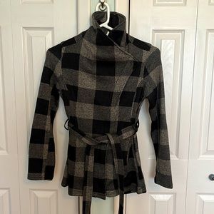 Buffalo Plaid knit jacket with belt. Zip closure, exterior side slit pockets.
